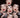 Collage of the same female face, with her finger to her red lips, like a kaleidoscope of faces