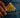 Fingers clutch condom sticking out of the small inner pocket of jeans