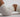 a body in white gym shorts and a gym crop top is arched on the ground