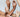 A close up of three pairs of hands, posed expressively among one another.