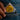 Fingers clutch condom sticking out of the small inner pocket of jeans