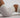 a body in white gym shorts and a gym crop top is arched on the ground