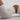 a body in white gym shorts and a gym crop top is arched on the ground
