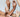 A close up of three pairs of hands, posed expressively among one another.