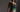 A woman wearing an emerald green lingerie set by Bordelle