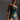 A woman wearing an emerald green lingerie set by Bordelle